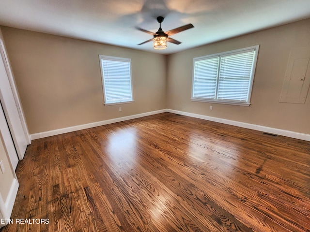 212 Ellison Rd, Lafollette, TN 37766 - unfurnished room featuring a ceiling fan, healthy amount of natural light, dark wood-style flooring, and electric panel