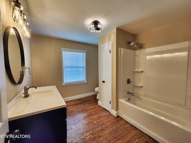 212 Ellison Rd, Lafollette, TN 37766 - full bathroom featuring vanity, wood finished floors, shower / washtub combination, and a textured ceiling