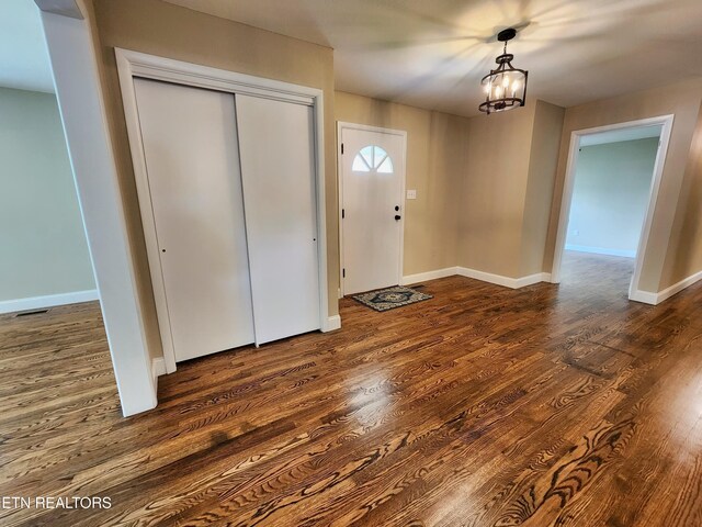 212 Ellison Rd, Lafollette, TN 37766 - entryway featuring dark wood-style flooring and a chandelier