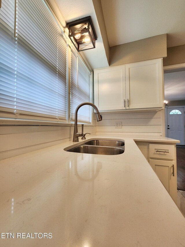 212 Ellison Rd, Lafollette, TN 37766 - kitchen featuring a sink and white cabinetry