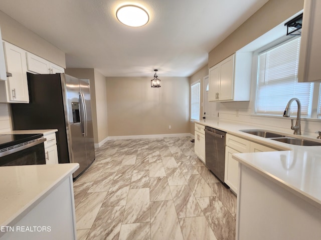 212 Ellison Rd, Lafollette, TN 37766 - kitchen featuring stainless steel dishwasher, black / electric stove, white cabinets, light countertops, and pendant lighting