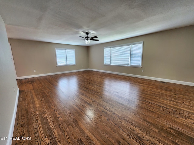 212 Ellison Rd, Lafollette, TN 37766 - spare room featuring ceiling fan, dark wood-style floors, and a textured ceiling
