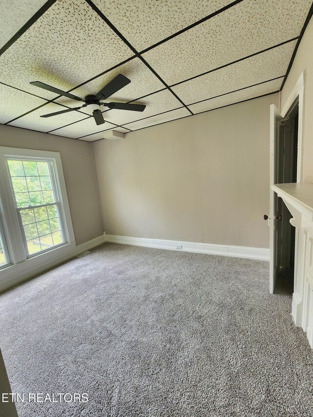 918 5th St, Jellico, TN 37762 - spare room featuring carpet flooring, a ceiling fan, and a paneled ceiling