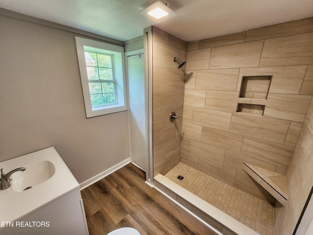 918 5th St, Jellico, TN 37762 - bathroom featuring a shower stall, wood finished floors, and vanity