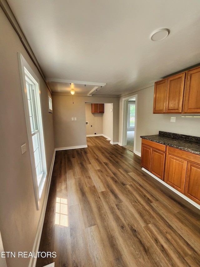 918 5th St, Jellico, TN 37762 - kitchen featuring brown cabinetry and dark wood-style floors