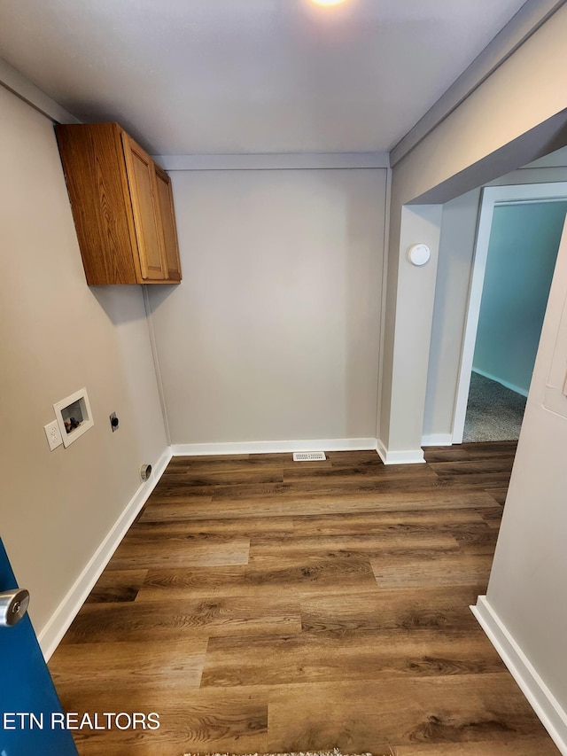 918 5th St, Jellico, TN 37762 - laundry room with washer hookup, dark wood finished floors, electric dryer hookup, and cabinet space