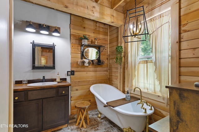 187 Persimmon Ln, Pioneer, TN 37847 - bathroom with wooden walls, vanity, a freestanding bath, and a chandelier