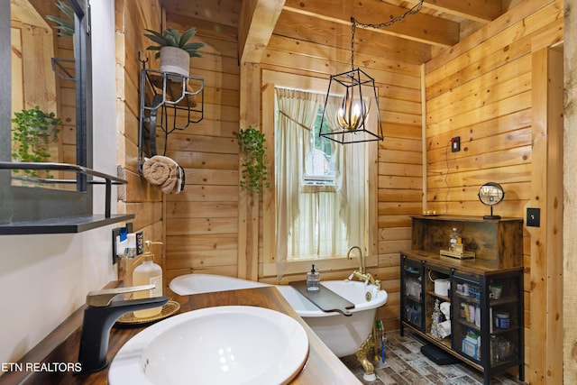 187 Persimmon Ln, Pioneer, TN 37847 - full bathroom featuring a freestanding bath, a chandelier, and wood walls