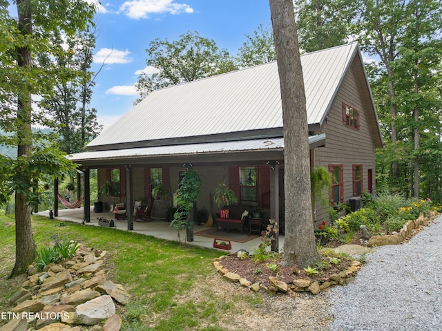187 Persimmon Ln, Pioneer, TN 37847 - view of property exterior featuring a patio area, an outdoor hangout area, a metal roof, and ceiling fan