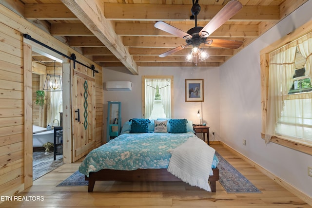 187 Persimmon Ln, Pioneer, TN 37847 - bedroom with a barn door, a wall unit AC, a wood ceiling with exposed beams, and hardwood / wood-style floors