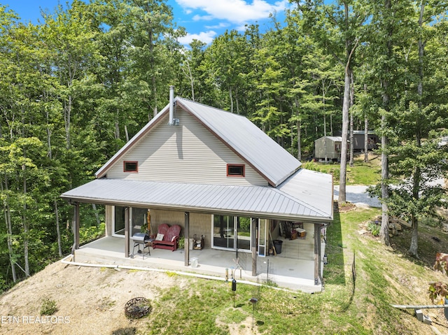 187 Persimmon Ln, Pioneer, TN 37847 - rear view of property with a metal roof, a patio area, and a yard