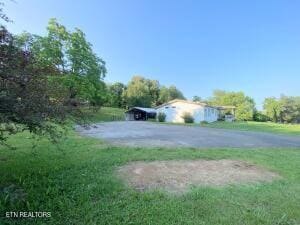 2517 Shields Ferry Rd, Morristown, TN 37814 - view of green lawn with driveway
