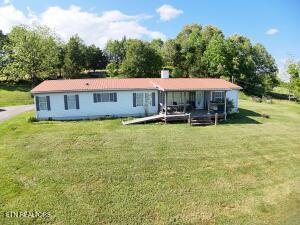2517 Shields Ferry Rd, Morristown, TN 37814 - back of house with a lawn and a chimney