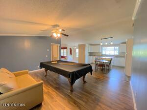 2517 Shields Ferry Rd, Morristown, TN 37814 - game room with wood finished floors, billiards, and a ceiling fan
