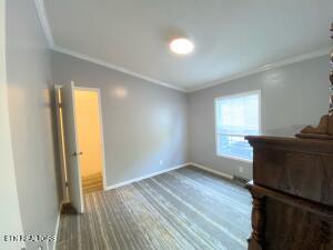 2517 Shields Ferry Rd, Morristown, TN 37814 - unfurnished bedroom with crown molding and baseboards