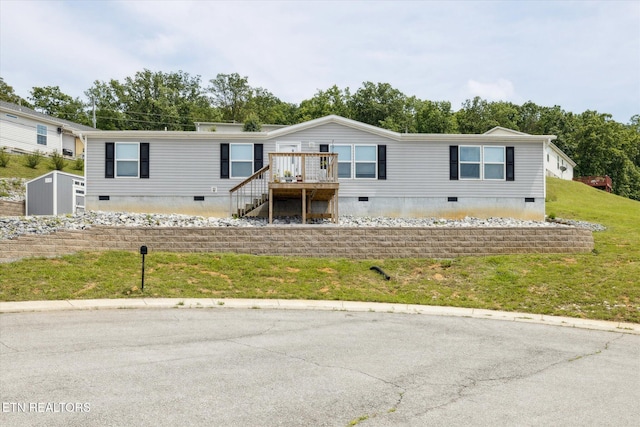 1309 Elm Village Ct, Dandridge, TN 37725 - manufactured / mobile home featuring crawl space, stairs, a front lawn, and a deck