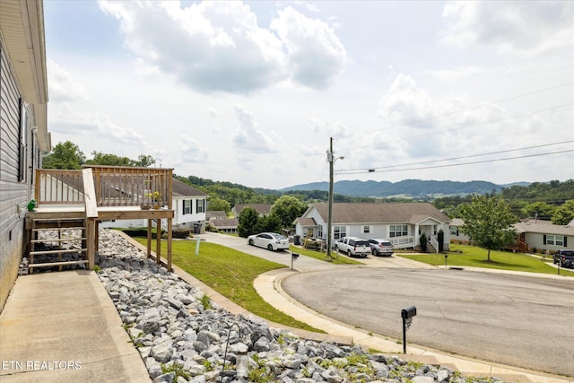 1309 Elm Village Ct, Dandridge, TN 37725 - view of grassy yard with a deck with mountain view, a residential view, and stairway