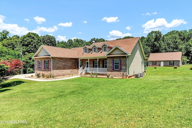 1721 N Parkridge Dr, Knoxville, TN 37924 - view of front facade featuring covered porch, brick siding, and a front yard