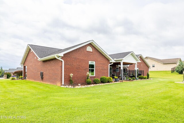 1045 Southwind Cir, Dandridge, TN 37725 - back of property with brick siding and a lawn