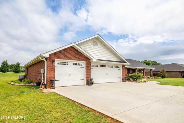 1045 Southwind Cir, Dandridge, TN 37725 - single story home featuring brick siding, a front lawn, and concrete driveway