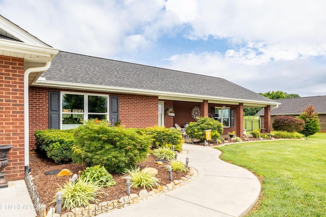 1045 Southwind Cir, Dandridge, TN 37725 - ranch-style home featuring brick siding, a front lawn, and roof with shingles