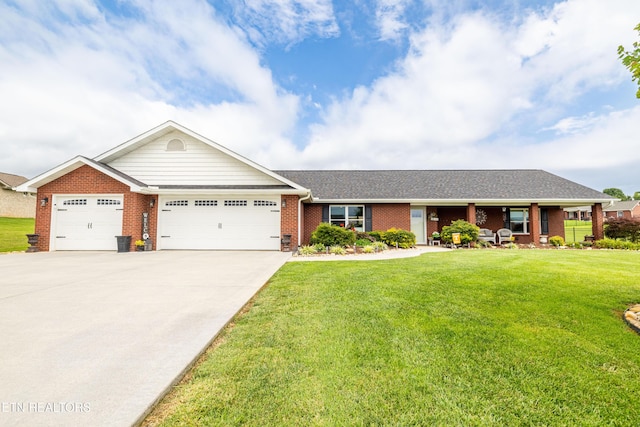 1045 Southwind Cir, Dandridge, TN 37725 - ranch-style home featuring a garage, brick siding, a front lawn, and concrete driveway