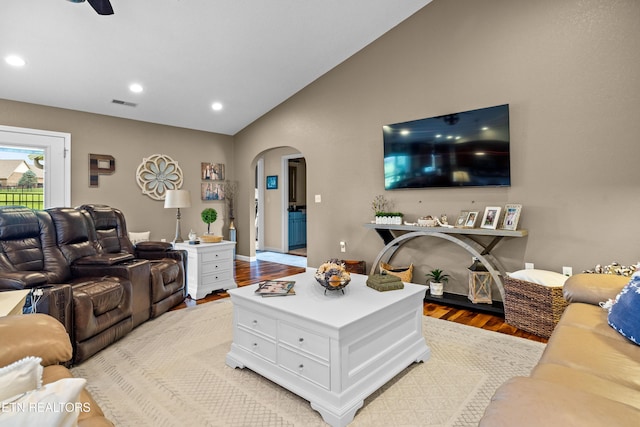 1045 Southwind Cir, Dandridge, TN 37725 - living room featuring arched walkways, light wood-style floors, lofted ceiling, recessed lighting, and ceiling fan