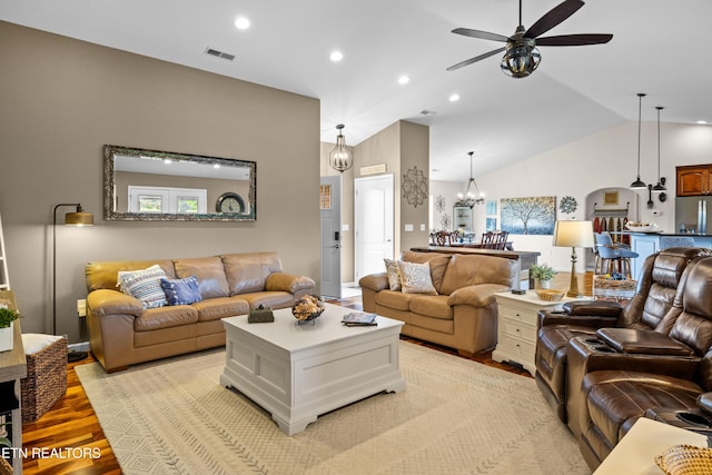 1045 Southwind Cir, Dandridge, TN 37725 - living area featuring ceiling fan, light wood-style flooring, vaulted ceiling, recessed lighting, and a chandelier