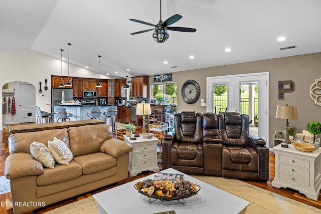 1045 Southwind Cir, Dandridge, TN 37725 - living area featuring lofted ceiling, ceiling fan, arched walkways, wood finished floors, and recessed lighting