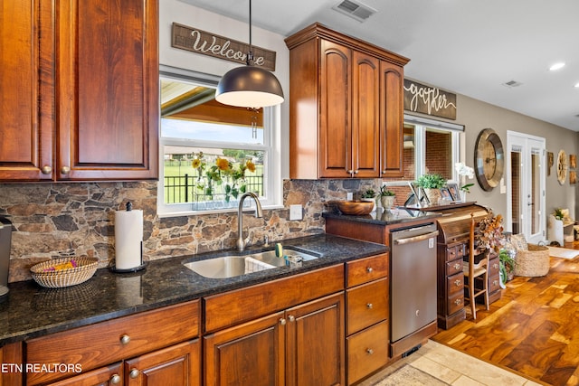 1045 Southwind Cir, Dandridge, TN 37725 - kitchen featuring dishwasher, decorative backsplash, dark stone countertops, recessed lighting, and pendant lighting