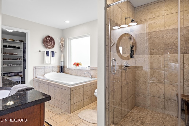 1045 Southwind Cir, Dandridge, TN 37725 - full bath with a garden tub, a stall shower, a spacious closet, and vanity