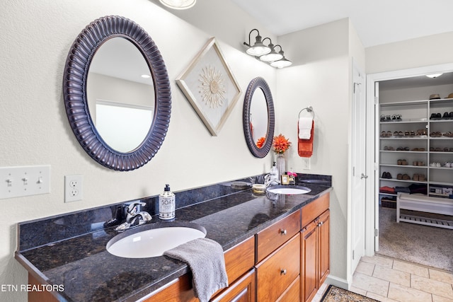1045 Southwind Cir, Dandridge, TN 37725 - full bath featuring double vanity, stone tile floors, and a walk in closet