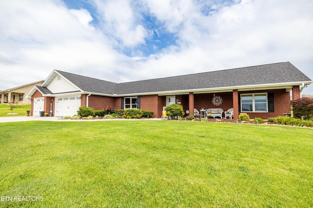 1045 Southwind Cir, Dandridge, TN 37725 - ranch-style home with brick siding, an attached garage, and a front lawn