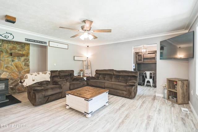 1820 Locust Grove Rd, New Tazewell, TN 37825 - living area with a wood stove, a ceiling fan, wood finished floors, and ornamental molding