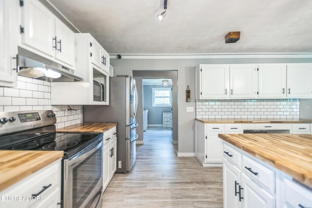 1820 Locust Grove Rd, New Tazewell, TN 37825 - kitchen featuring butcher block countertops, stainless steel range with electric stovetop, under cabinet range hood, a textured ceiling, and light wood-type flooring
