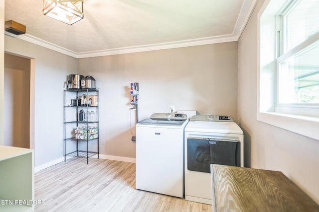 1820 Locust Grove Rd, New Tazewell, TN 37825 - washroom with washer and dryer, light wood finished floors, and ornamental molding