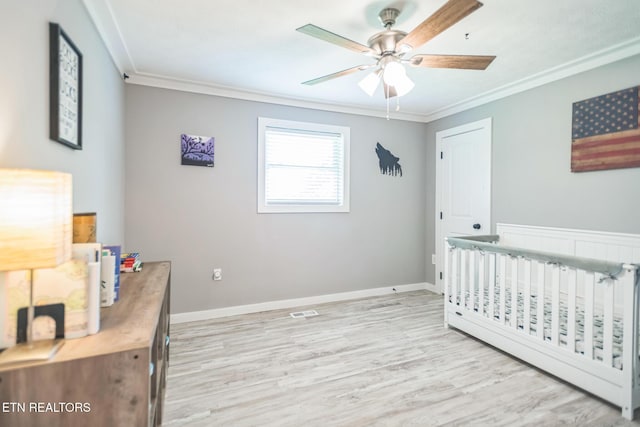 1820 Locust Grove Rd, New Tazewell, TN 37825 - bedroom with crown molding, light wood-style flooring, a crib, and ceiling fan
