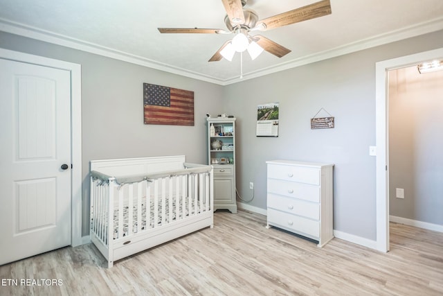 1820 Locust Grove Rd, New Tazewell, TN 37825 - bedroom with light wood-type flooring, a crib, crown molding, and ceiling fan
