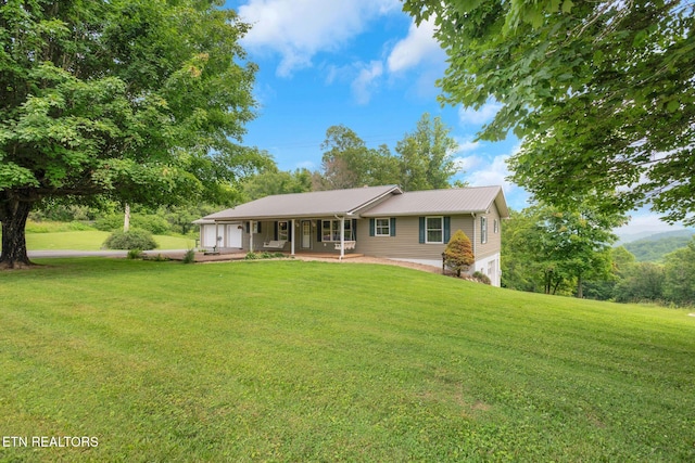 1820 Locust Grove Rd, New Tazewell, TN 37825 - single story home featuring a front lawn, a porch, an attached garage, and a metal roof