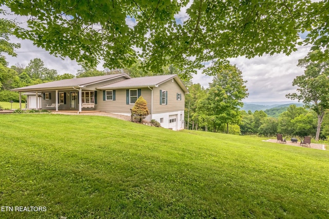 1820 Locust Grove Rd, New Tazewell, TN 37825 - view of front of property featuring a porch, a garage, and a front lawn