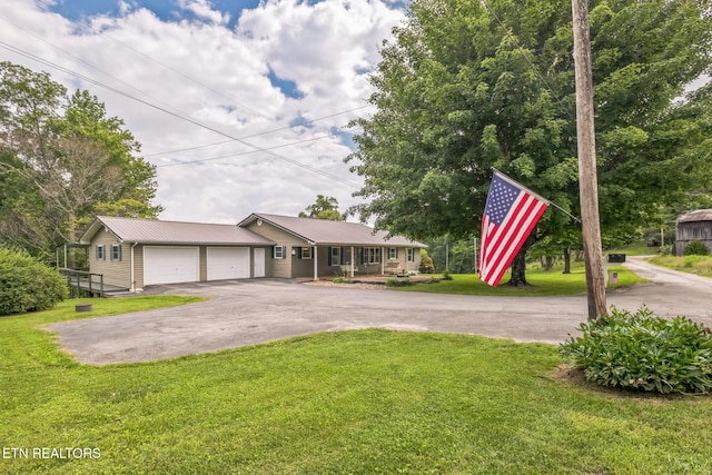 1820 Locust Grove Rd, New Tazewell, TN 37825 - ranch-style home with asphalt driveway, a garage, a front lawn, and a metal roof