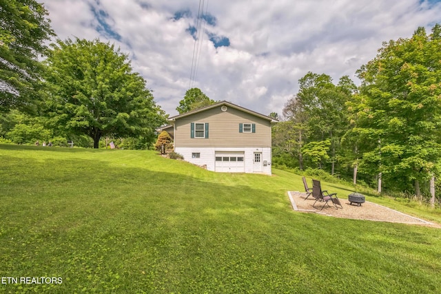 1820 Locust Grove Rd, New Tazewell, TN 37825 - view of grassy yard with a fire pit and a garage