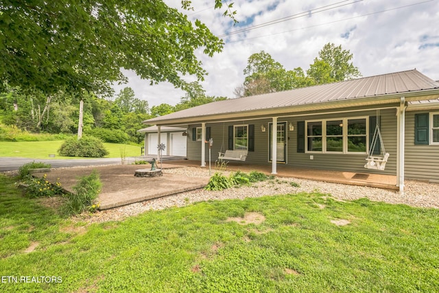 1820 Locust Grove Rd, New Tazewell, TN 37825 - back of property featuring a porch, a yard, driveway, and a metal roof