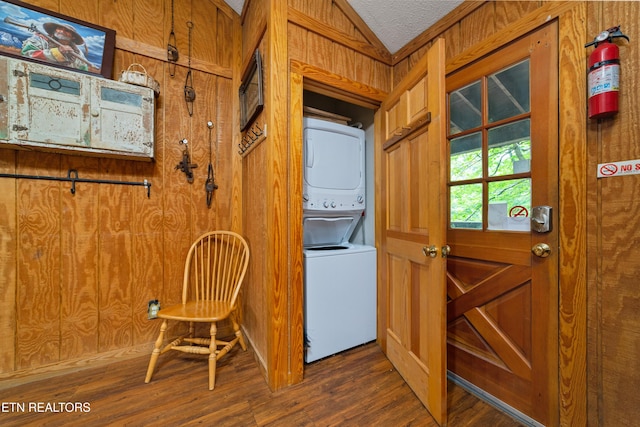 719 Kings Hills Blvd, Pigeon Forge, TN 37863 - doorway with stacked washer / drying machine, wood finished floors, and lofted ceiling