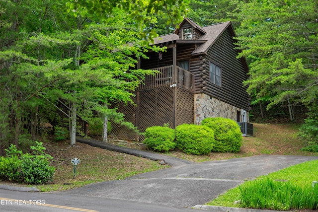 719 Kings Hills Blvd, Pigeon Forge, TN 37863 - view of side of home featuring stone siding and log exterior