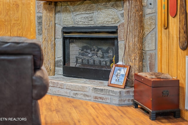 719 Kings Hills Blvd, Pigeon Forge, TN 37863 - detailed view of a stone fireplace and wood finished floors