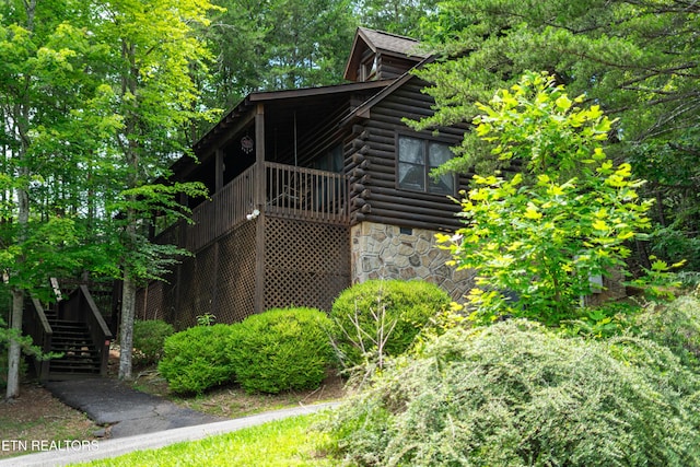 719 Kings Hills Blvd, Pigeon Forge, TN 37863 - view of side of property with stairs, log siding, and stone siding