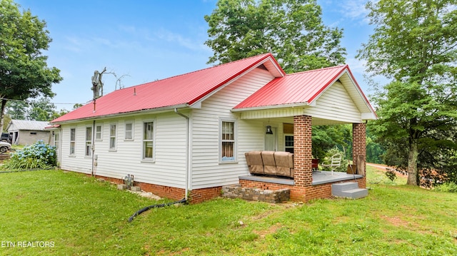 5750 E Lee Hwy, Loudon, TN 37774 - view of side of property featuring a yard and a metal roof