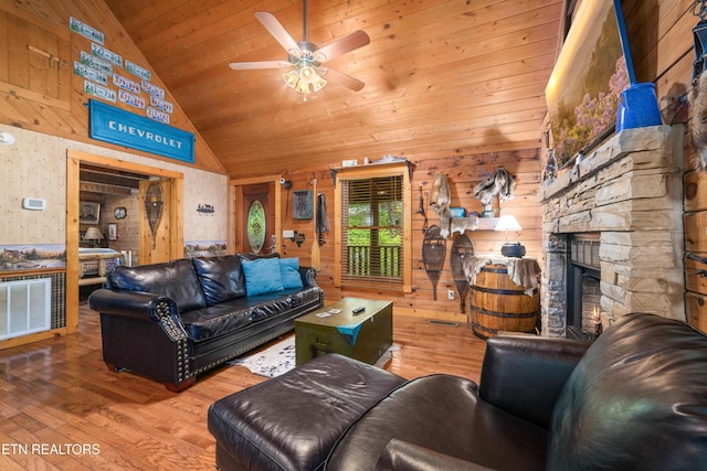 2389 Misty Ln, Sevierville, TN 37876 - living room featuring hardwood / wood-style flooring, a ceiling fan, wood ceiling, wooden walls, and high vaulted ceiling