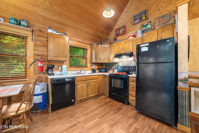 2389 Misty Ln, Sevierville, TN 37876 - kitchen featuring black appliances, under cabinet range hood, light countertops, light wood-style flooring, and tasteful backsplash